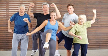 Group of senior living community residents working out